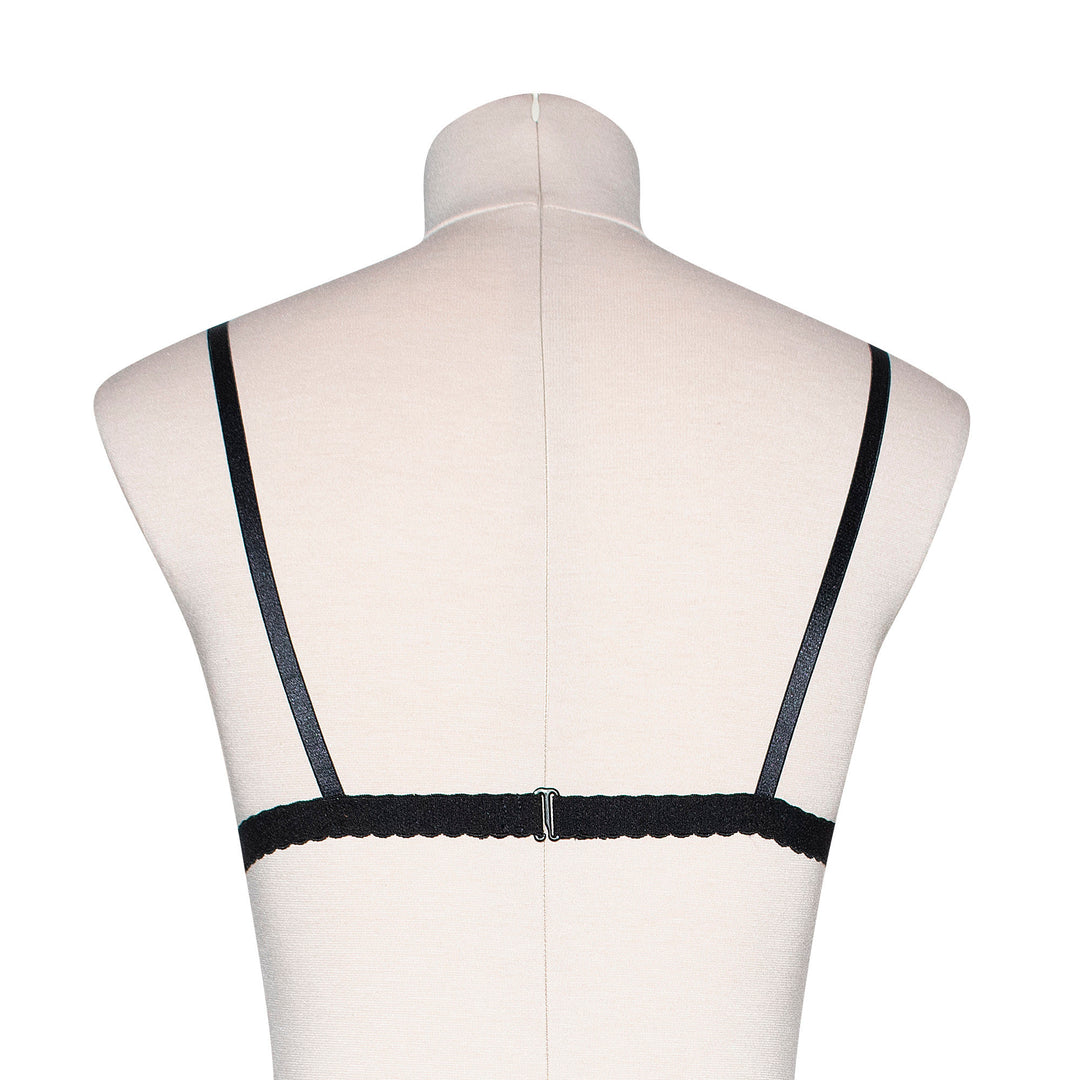 Peachy pink sheer mesh bralette with black velvet bow appliqué
