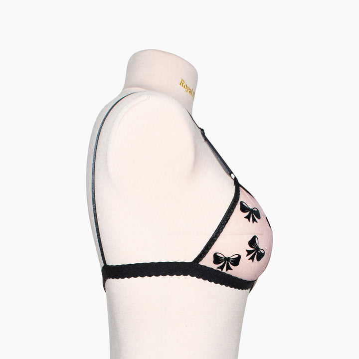 Peachy pink sheer mesh bralette with black velvet bow appliqué